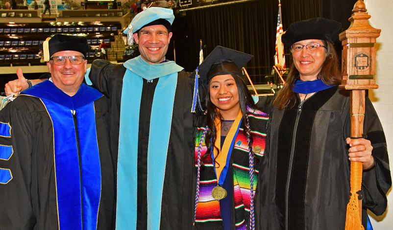 Alma posing with university professors and officials after receiving the Catherine McAuley award